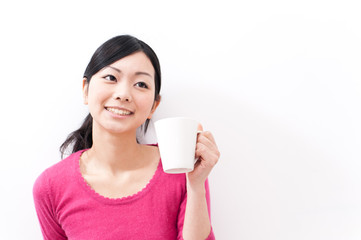 beautiful asian woman holding a cup