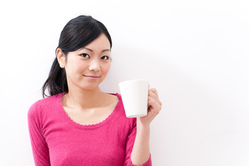 beautiful asian woman holding a cup