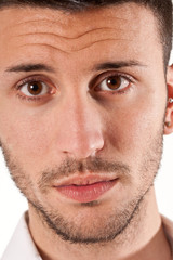 Obraz premium Serious young man portrait isolated on white