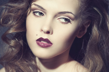 Fototapeta premium Closeup portrait of a sexy young woman with red lips