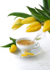 Yellow tulips and tea