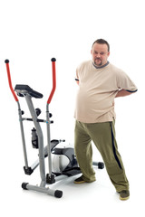 Fototapeta na wymiar Overweight man stretching his back near a trainer device