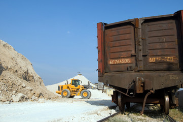 excavator loads gravel