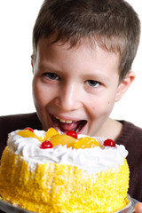 Boy eats a tasty cake
