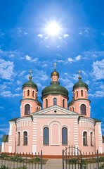 Fototapeta na wymiar christian church in a sunny sky background