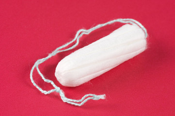 Ladies feminine hygiene product on a red background