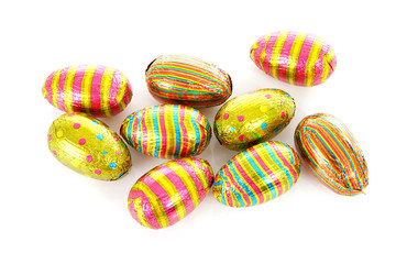 colorful chocolate easter eggs over white background