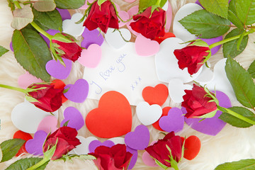 Romantic note with hearts and roses