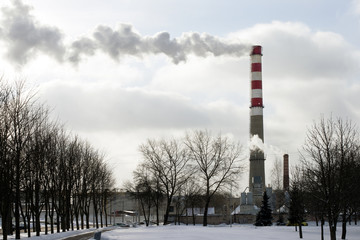 Factory pipe, emitting a cloud of white smoke