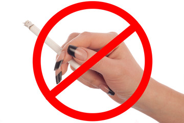 Female hand holds a cigarette