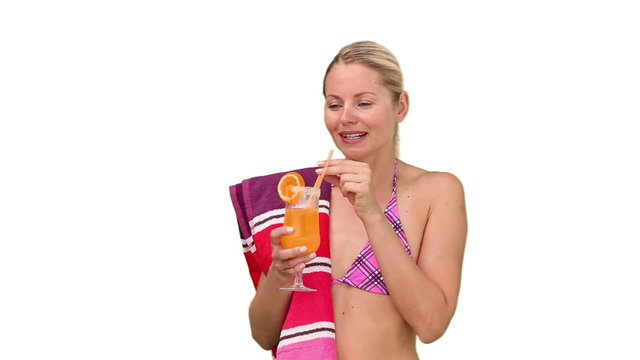 Attractive woman in swimsuit drinking cocktail