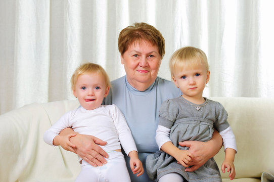 two twins sisters with their grandmother