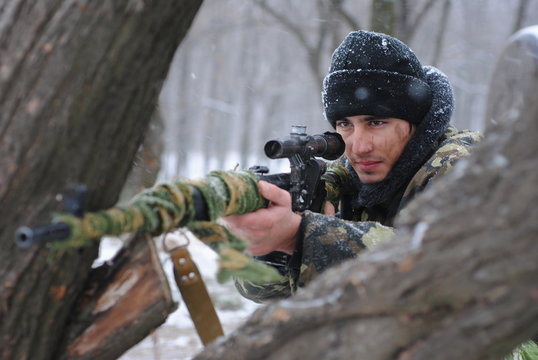 The soldier. The sniper. A sniper rifle.