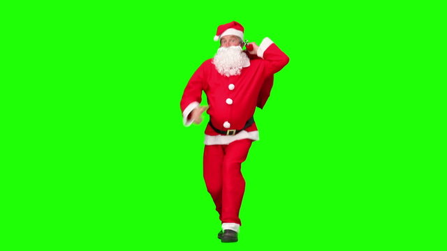 Santa Claus holding a bag of gift and dancing