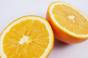 Two pieces of orange, Two pieces of orange, showing texture.