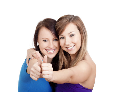 girls showing thumbs uo