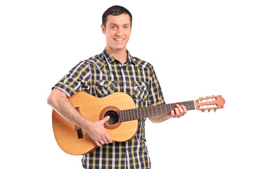 A man playing acoustic guitar