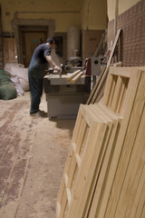 Carpenter using electric saw