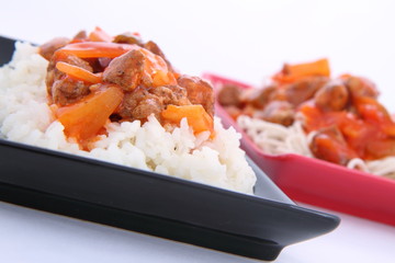 Sweet and sour chicken with rice and chow mein noodles