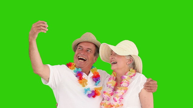 Retired couple in vacacion shooting themself