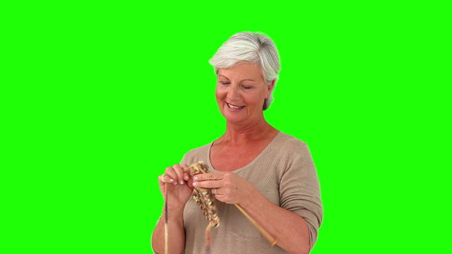 Retired woman knitting