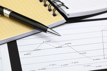 financial charts and graphs on the table