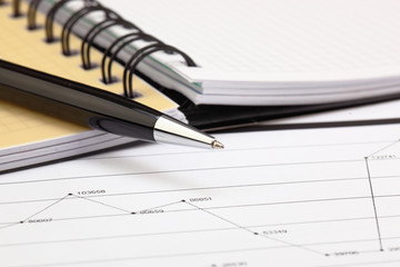 Naklejka premium financial charts and graphs on the table
