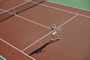 young woman play tennis outdoor
