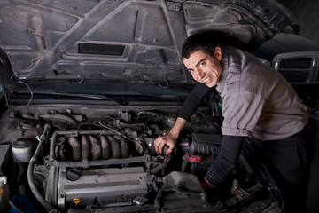 Fototapeta na wymiar Auto Repair Mechanic under the hood