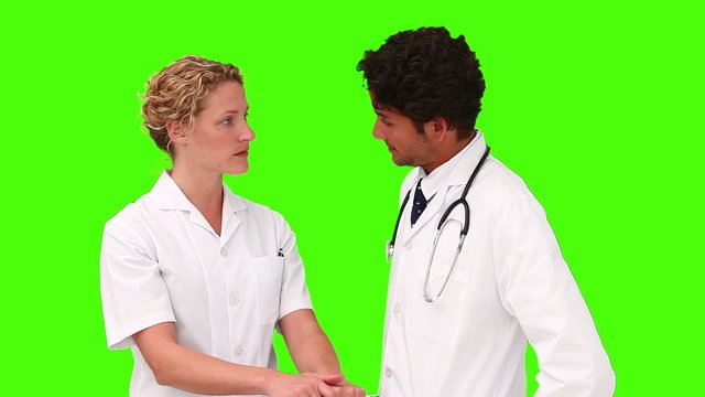 Two young doctors takling