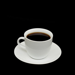 Obraz na płótnie Canvas White cup isolated on a black background