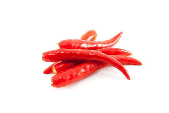 red chilli (stalk off) on white background