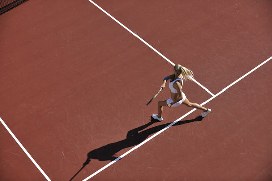 young woman play tennis outdoor