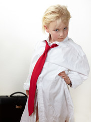 Cute blond child is playing big boss