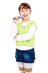 Cheerful girl cleaning teeth
