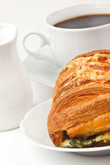 Breakfast: coffee and bun with cheese and spinach