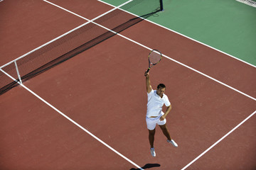 young man play tennis