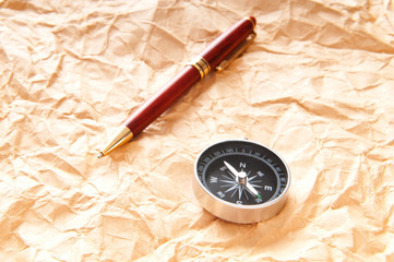 Vintage compass on the paper in adventure concept
