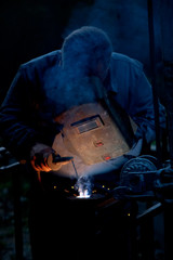 Industrial worker in welding process