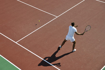 young man play tennis