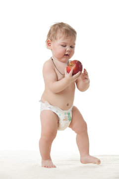 Sweet small baby with apple.
