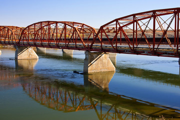 Red Bridge over the Calm River