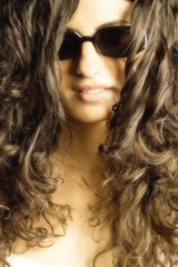Young Woman With Curls And Glasses