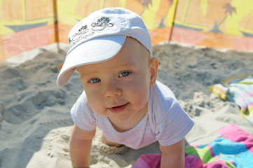 Happy toddler on the beach