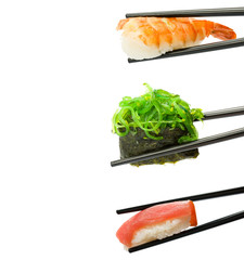 Sushi with chopsticks isolated over white background