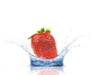 Strawberry falling into water