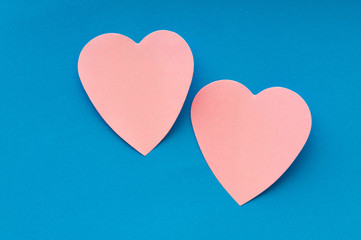 Heart shaped sticky notes on the background