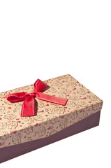 Christmas gift box on white background, with red ribbon