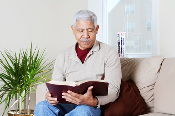 Senior Hipanic Man Reading Bible