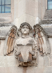 Angel figure on the church wall (Cambridge, UK)